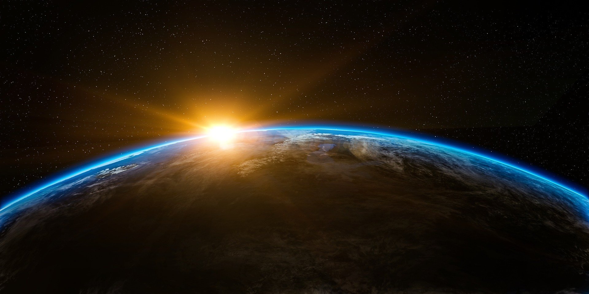 Dramatic view of Earth's horizon with sunrise and stars in the background, symbolizing a futuristic vision beyond space